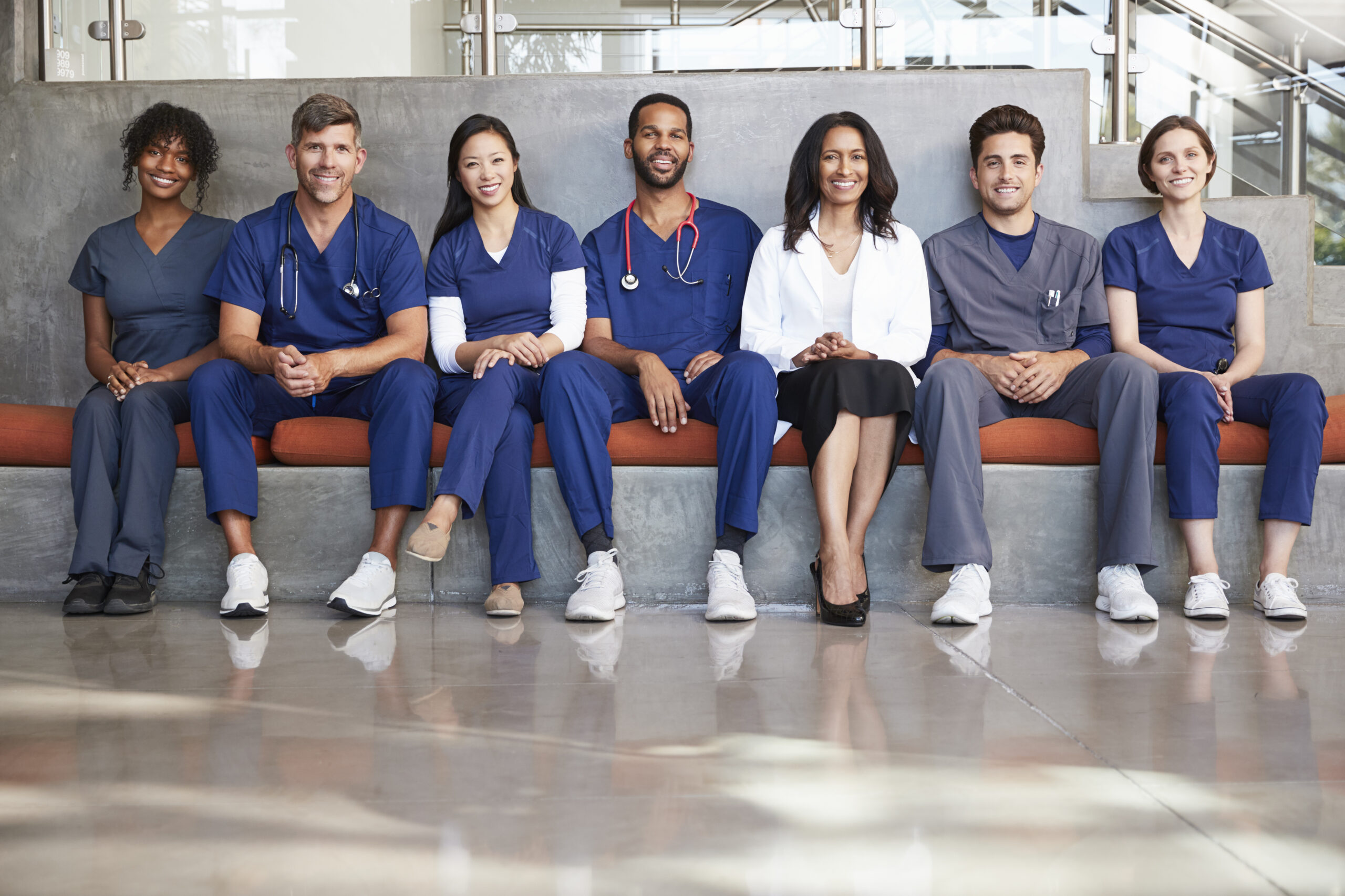 Healthcare workers sitting in a modern hospital low angle